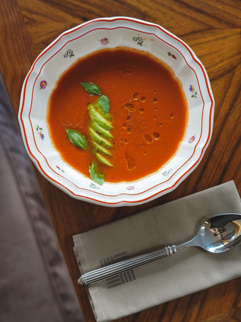 tomato soup in plate on table