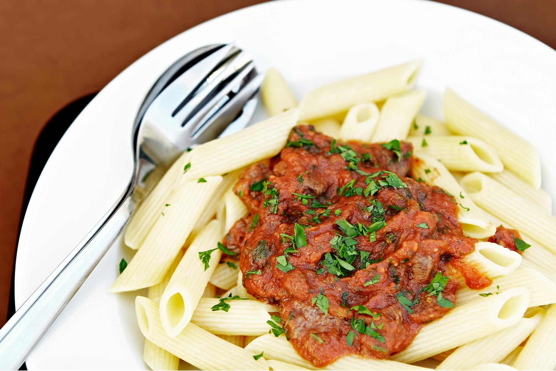 delicious penne pasta with tomato sauce dish