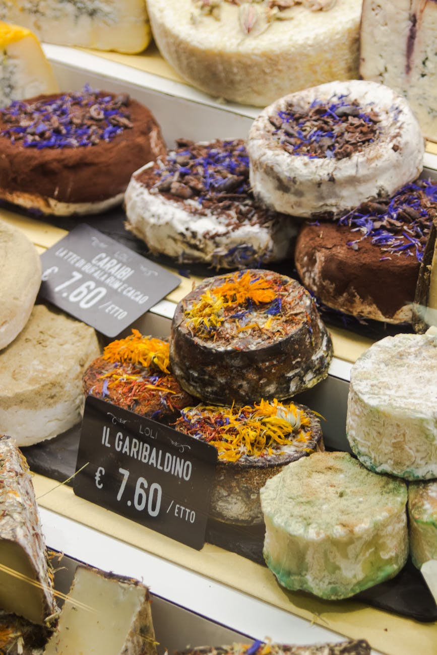 assorted italian cheeses in florentine market display