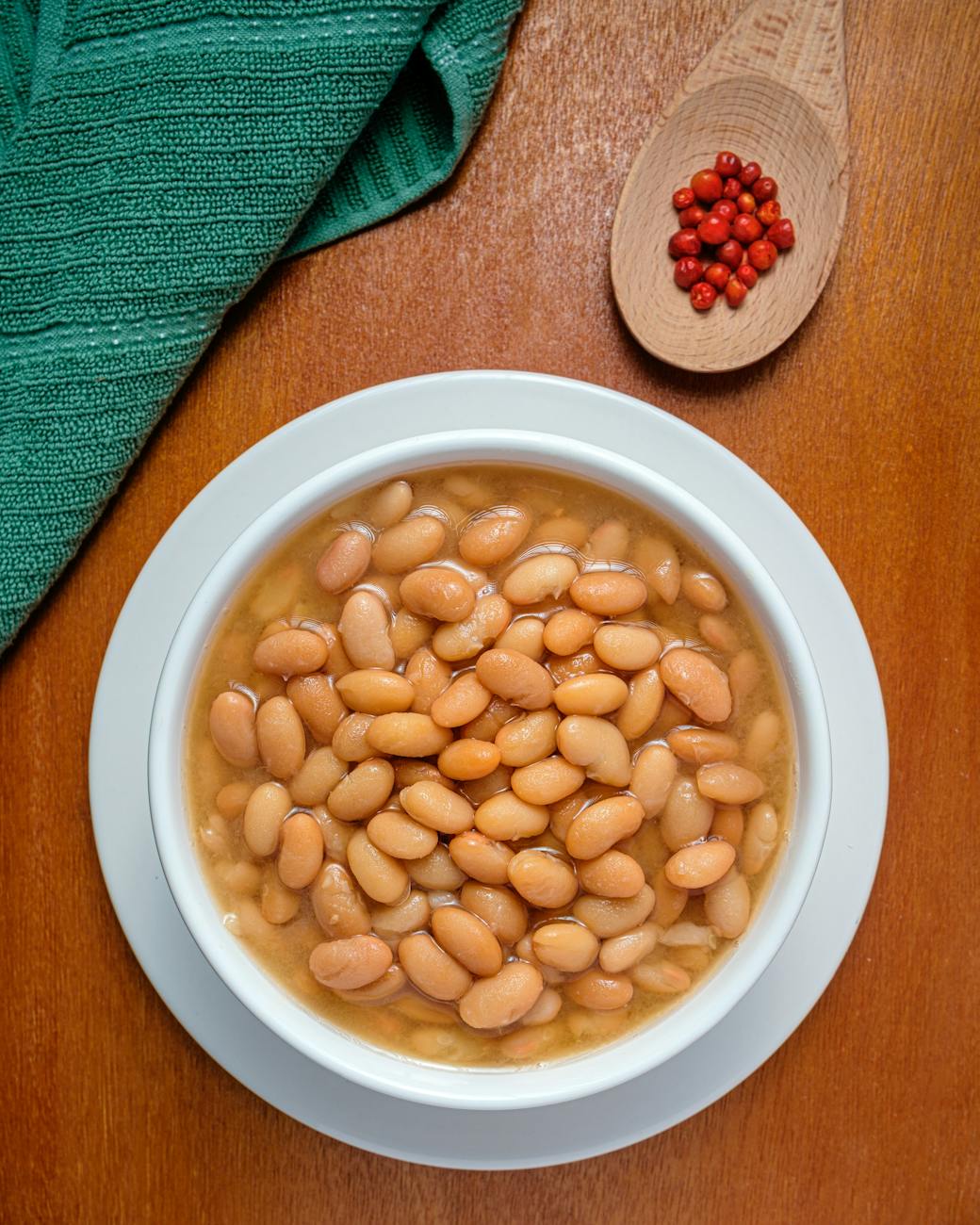 bowl of cooked white beans with paprika