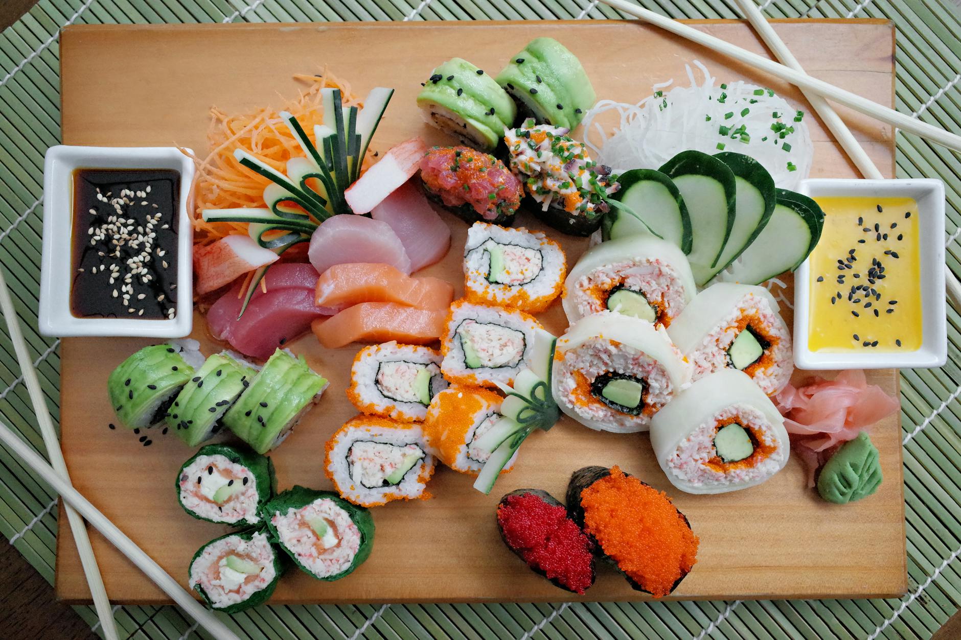 colorful sushi platter with various rolls and sashimi