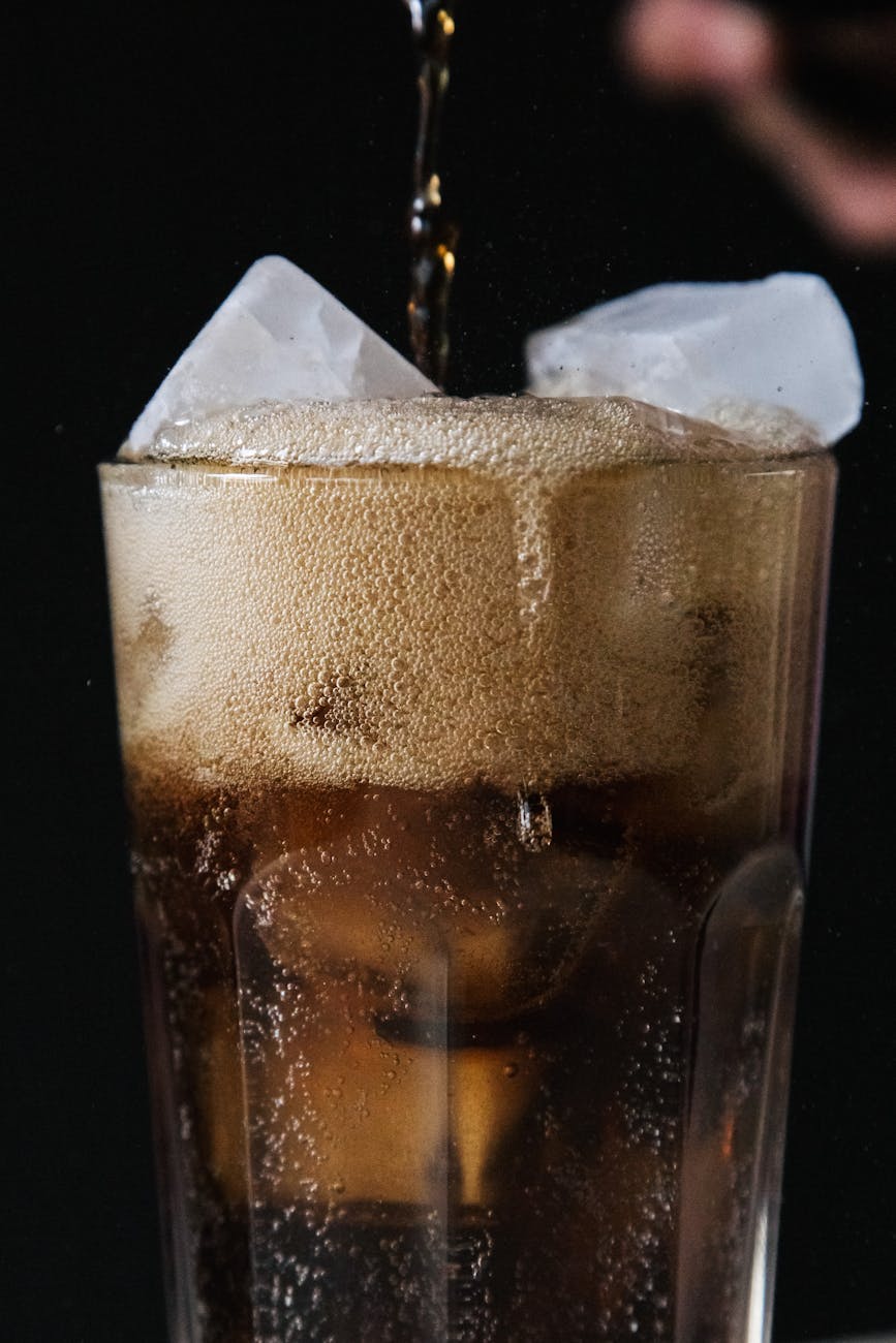 close up shot of a soft drink with ice cubes