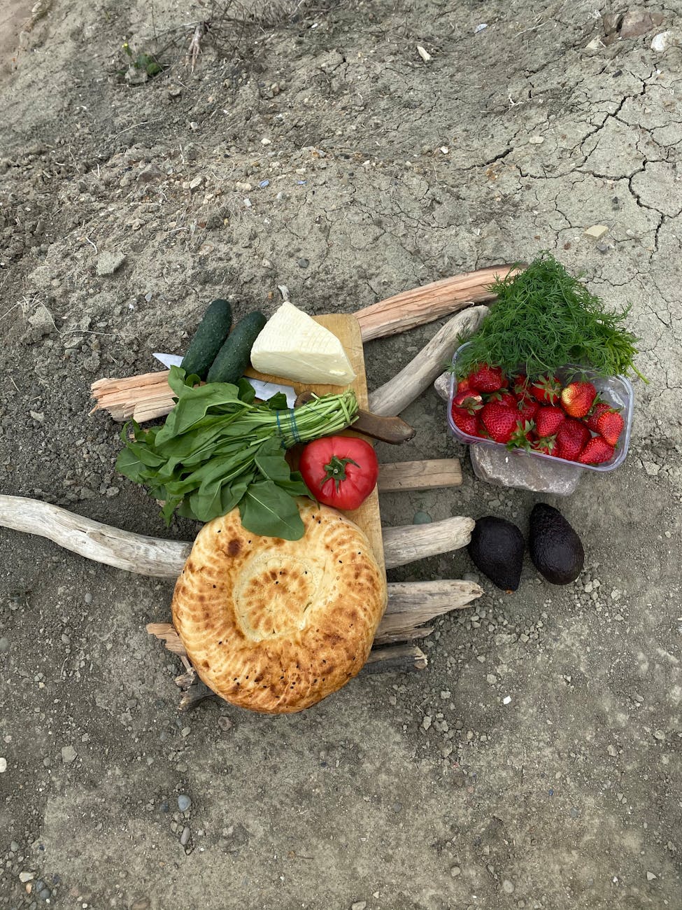 bread and assorted vegetables on the ground