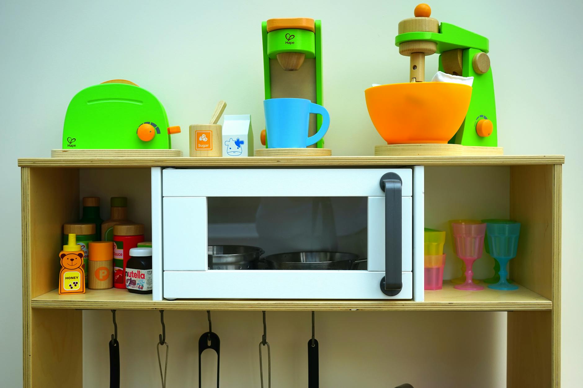 white oven in brown wooden rack