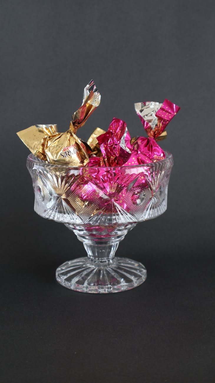 elegant crystal bowl filled with wrapped candies