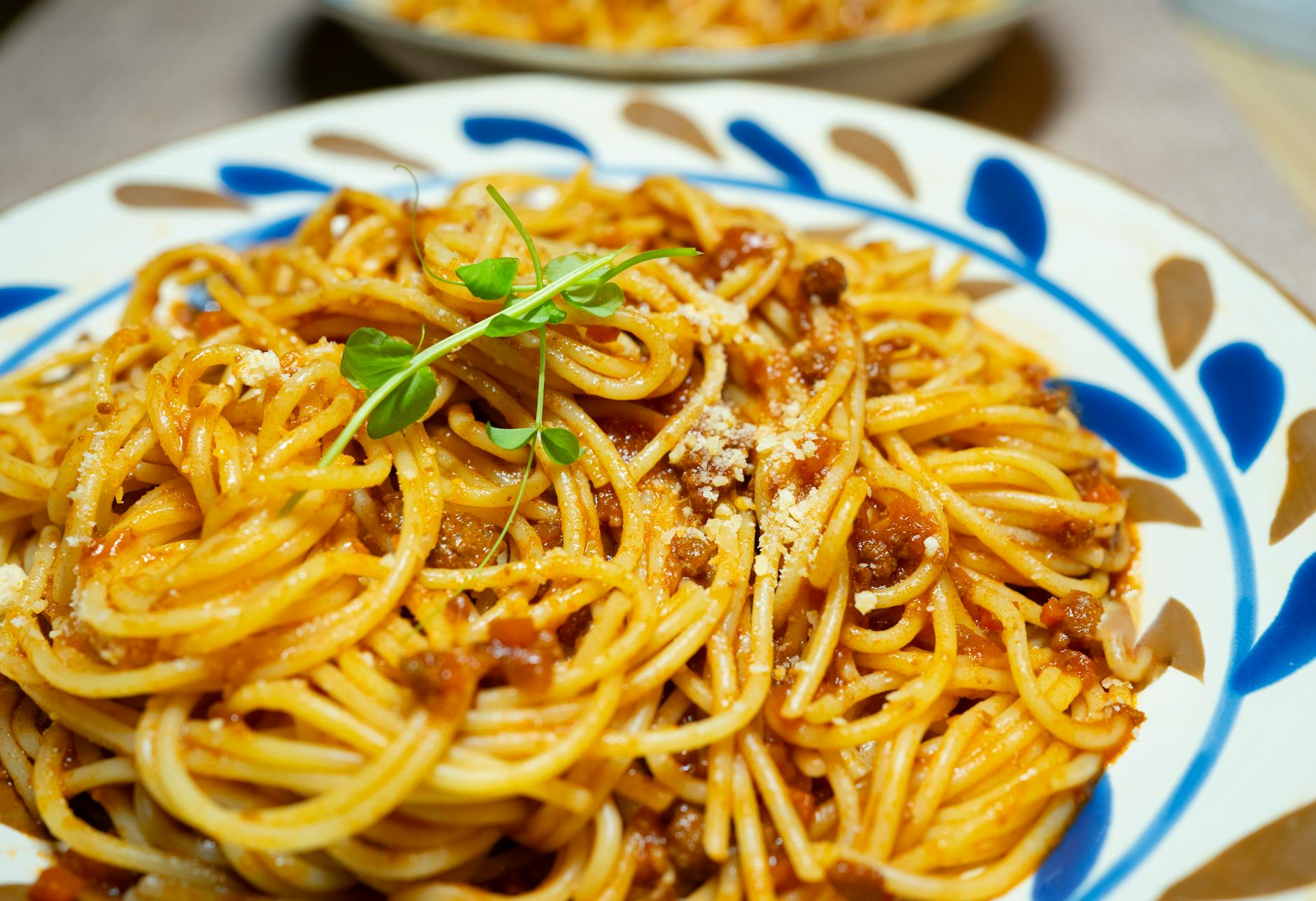 delicious spaghetti bolognese with fresh herbs