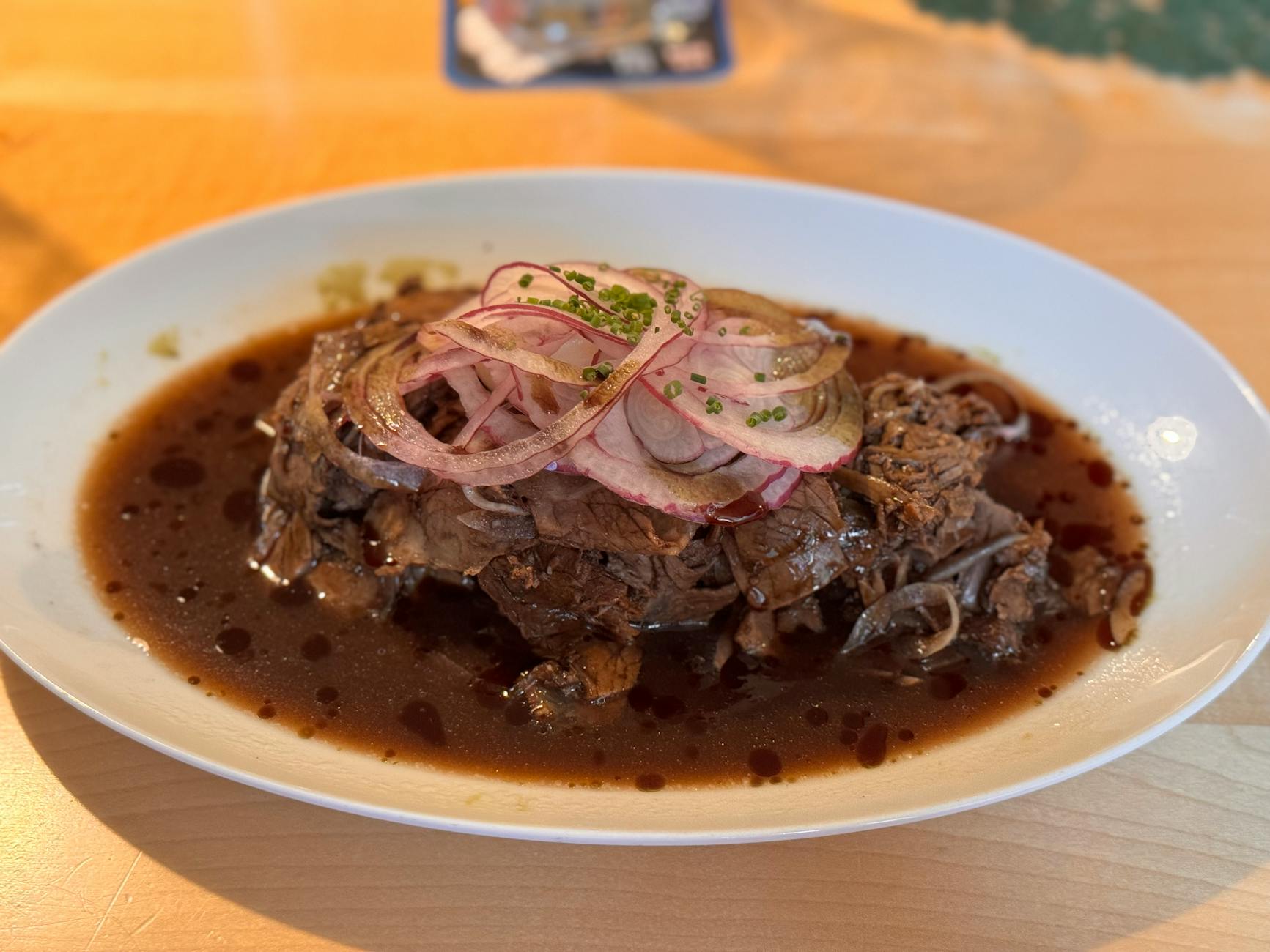 tender beef brisket with onions and gravy