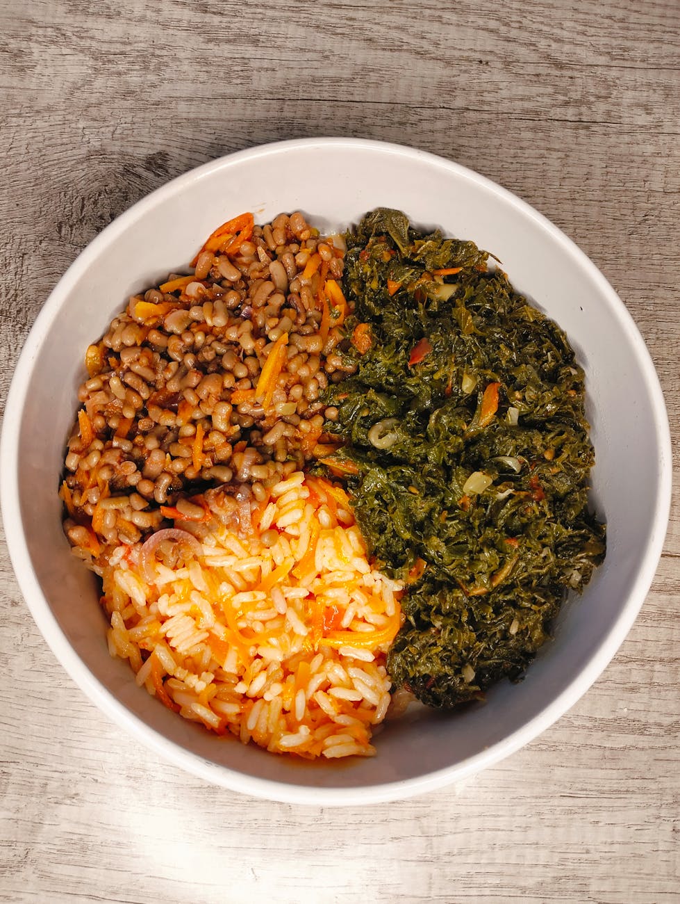 delicious african meal with rice and greens