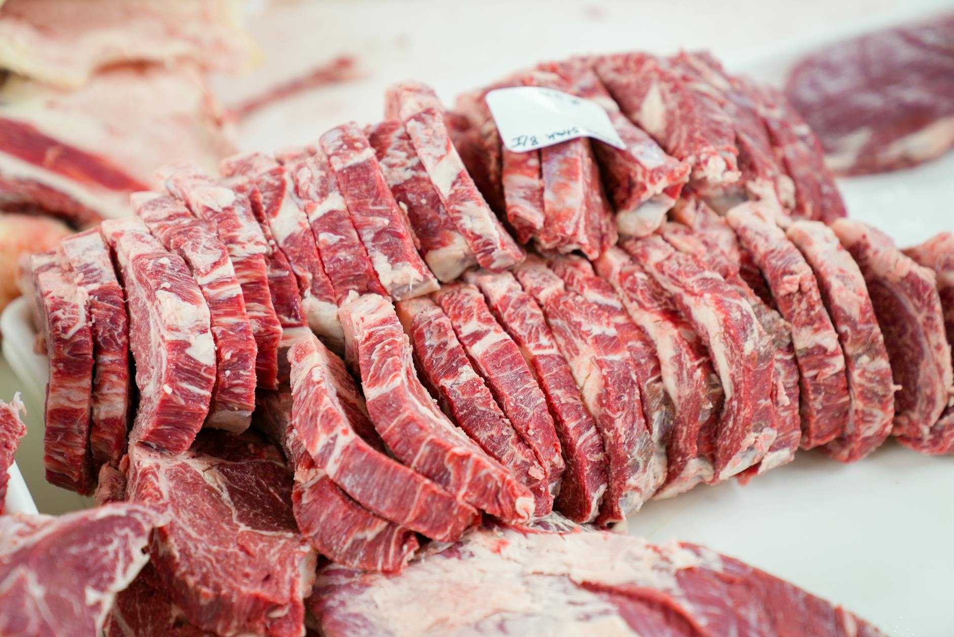 sliced meat on white tray