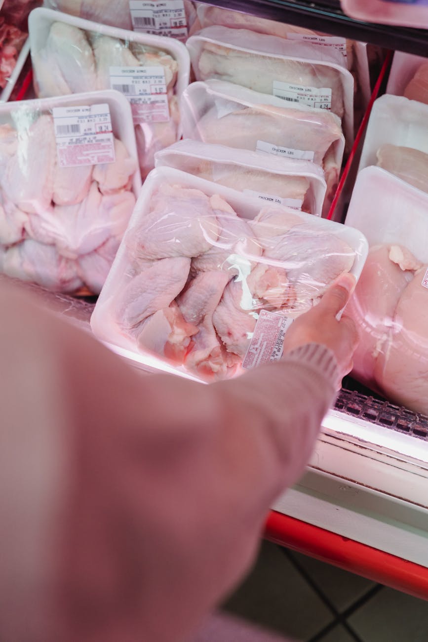 woman buying meat in a store