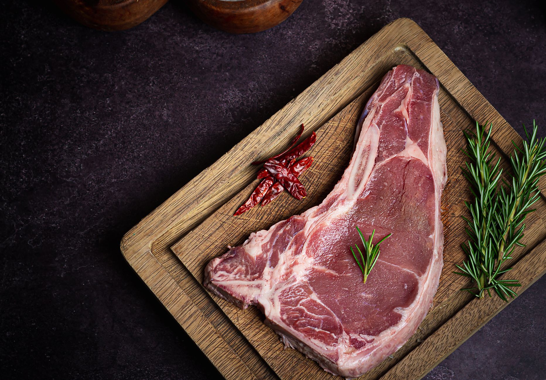 raw steak on cutting board